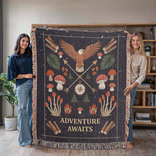 Adventure Awaits woven cotton blanket texture and fringed edge, displayed by two women